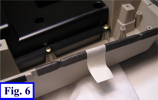 fig 6 using masking tape to hold edge material on case.